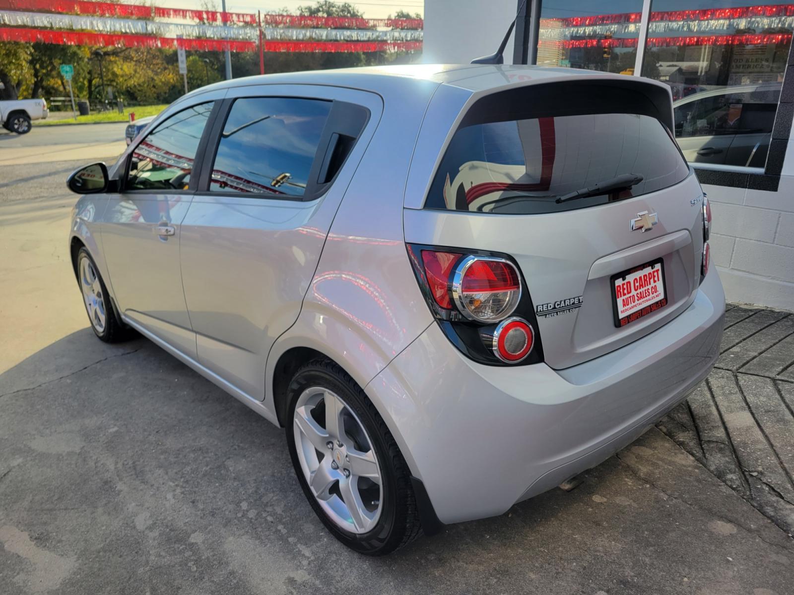 2014 SILVER Chevrolet Sonic (1G1JB6SH6E4) with an 1.8L I4 F DOHC 16V engine, Manual Transmission transmission, located at 503 West Court, Seguin, TX, 78155, (830) 379-3373, 29.568621, -97.969803 - 2014 Chevrolet Sonic LS Manual 5-Door with a 1.8L I4 F DOHC 16V, Standard Transmission, Tilt, AM/FM/AUX Stereo, Power Locks, Bluetooth, Tinted Windows, Onstar Capability, Alloy Wheels, Rear Wiper, Rear Defroster - Photo #3
